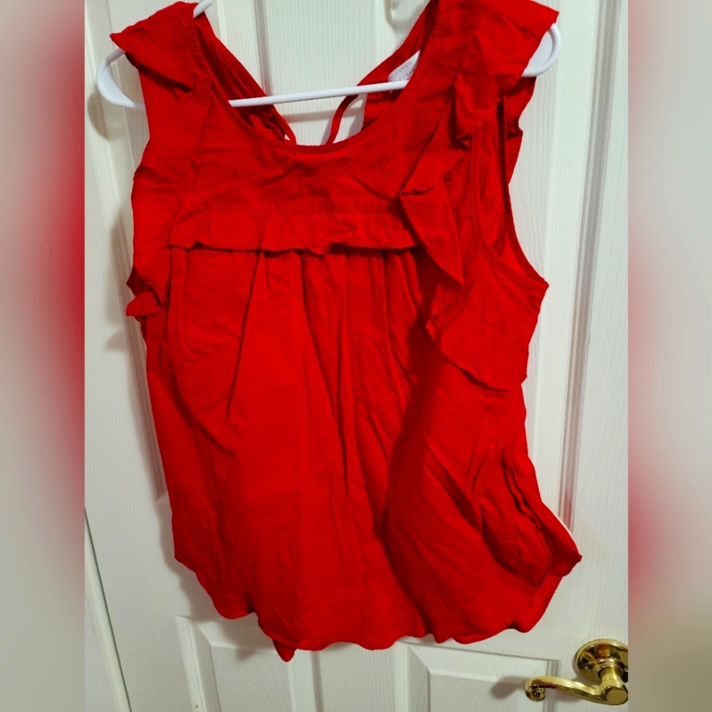 Red sleeveless blouse